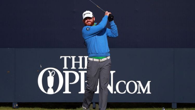 Holmes sets pace as McIlroy cards nightmare 79 at Open