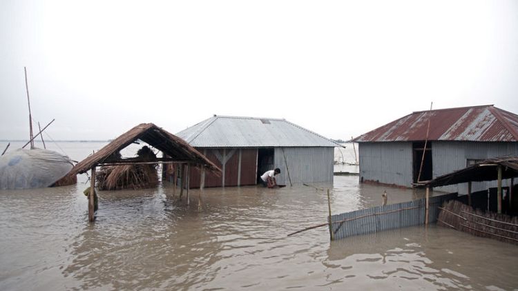 Bangladesh floods worsen after breach, death toll nears 100 in India