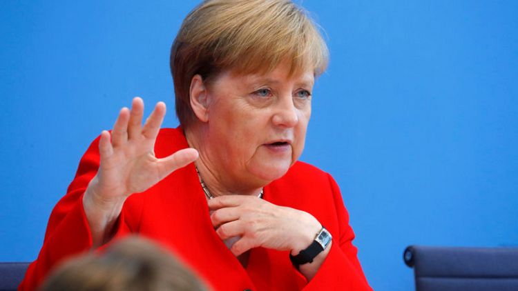 Merkel says she is working very well with SPD interim leadership