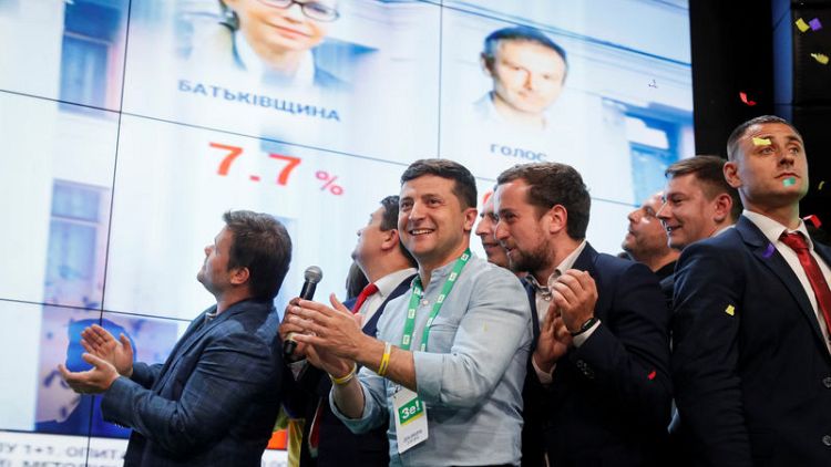 On course for election win, Ukraine president offers alliance with rock star's party