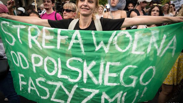 Polish police detain 25 after attacks on equality march Polish police detain 25 after attacks on equality march