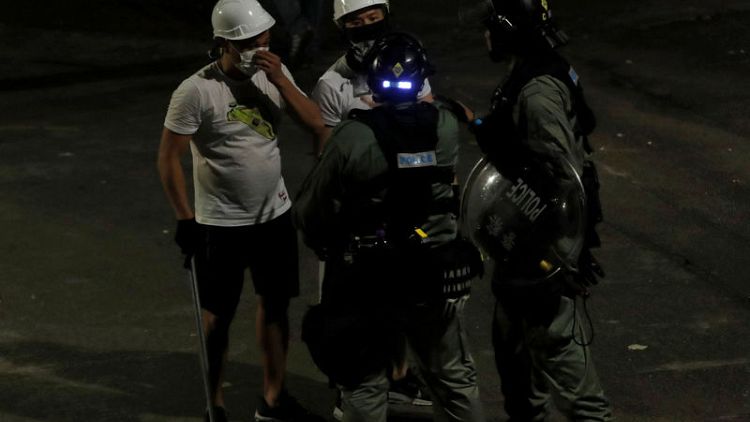 Hong Kong police criticised over failure to stop attacks on protesters
