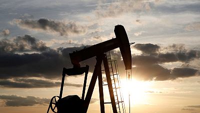 Oil prices gain on U.S. inventory drop, Middle East tensions