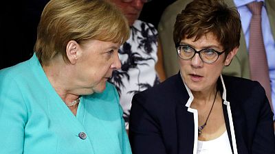 Eyeing power, Merkel protegee starts high-stakes defence job