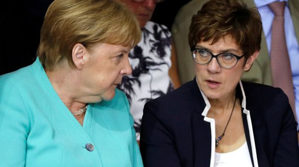 Eyeing power, Merkel protegee starts high-stakes defence job Eyeing power, Merkel protegee starts high-stakes defence job