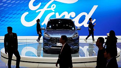 Ford results dented by restructuring, gives weaker-than-expected forecast