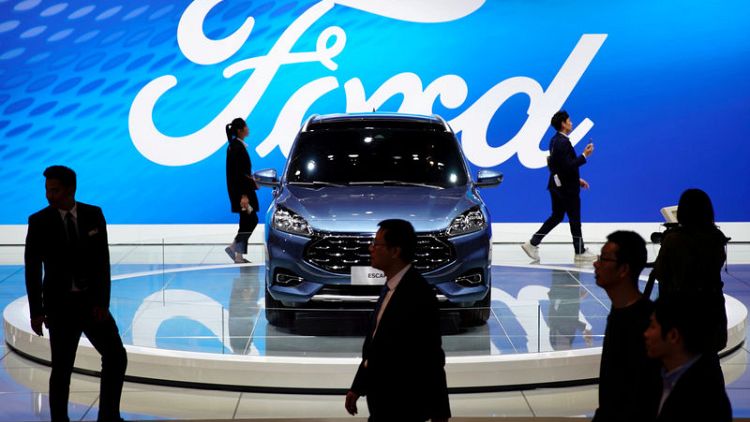 Ford results dented by restructuring, gives weaker-than-expected forecast
