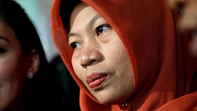Applause as Indonesia pardons woman jailed after reporting harassment