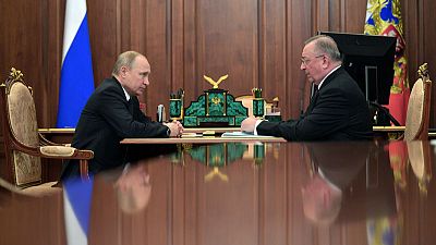 Putin allies' oil feud spills into public view