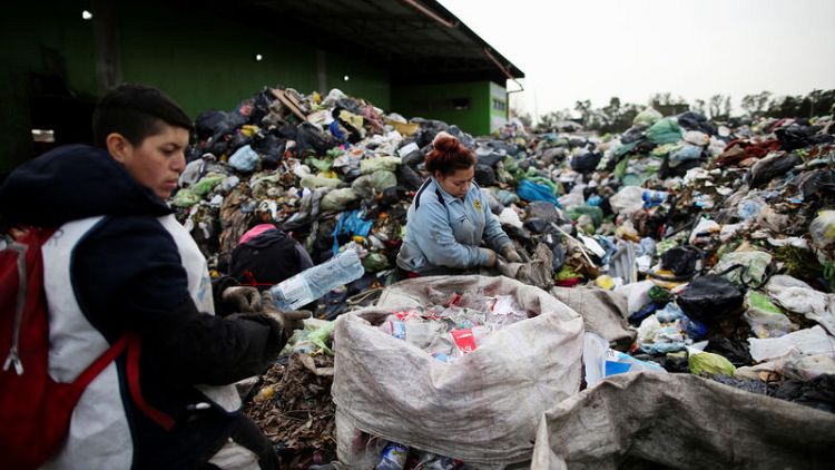 Argentine waste pickers find livelihood, community in mountain of trash