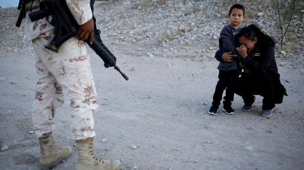 Reuters photo captures Guatemalan mother begging soldier to let her enter U.S Reuters photo captures Guatemalan mother begging soldier to let her enter U.S