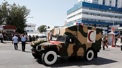 Mourning leader, Tunisians look forward to smooth transition