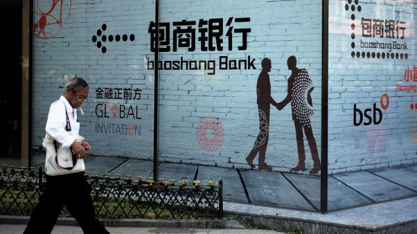 China probes small bank shareholdings as risk worries persist China probes small bank shareholdings as risk worries persist