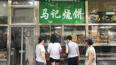 Sign of the times: China's capital orders Arabic, Muslim symbols taken down