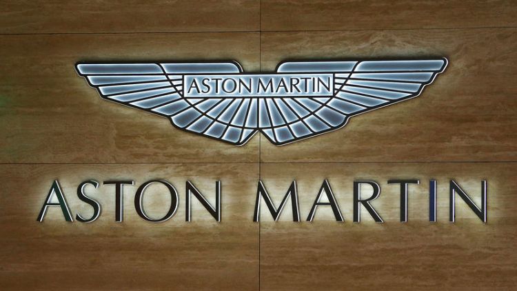 Carmaker Aston Martin swings to a half-year loss