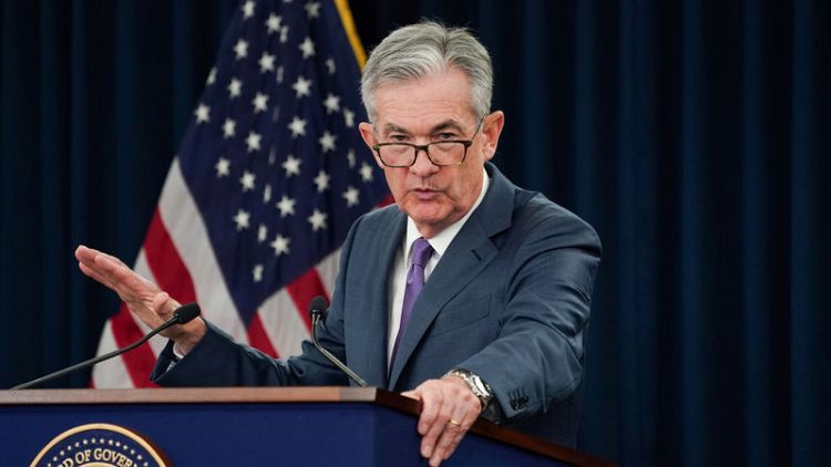 Fed cuts interest rates, signals it may not need to do more