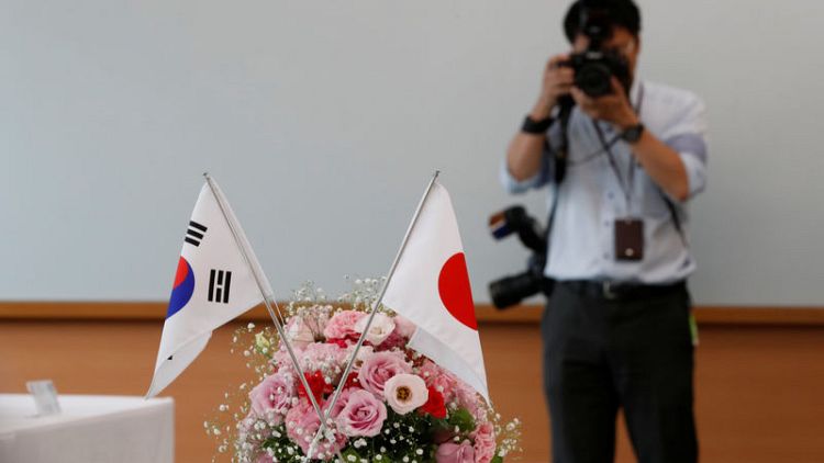 South Korea warns Japan of security pact risk, calls for 'cooling-off' in trade row