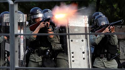 Hong Kong police fire tear gas, rubber bullets as strikes paralyse city Hong Kong police fire tear gas, rubber bullets as strikes paralyse city