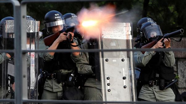 Hong Kong police fire tear gas, rubber bullets as strikes paralyse city Hong Kong police fire tear gas, rubber bullets as strikes paralyse city