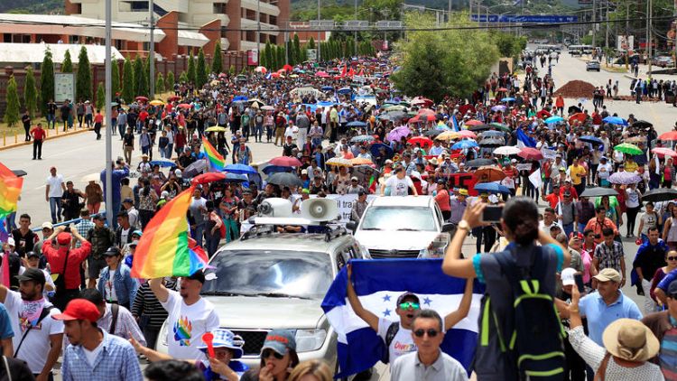 Thousands protest against Honduran president after drug link surfaces
