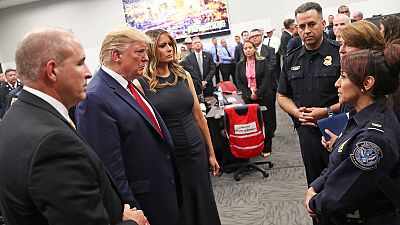 Trump visits mass shooting victims; protesters shout 'Do something!' Trump visits mass shooting victims; protesters shout 'Do something!'