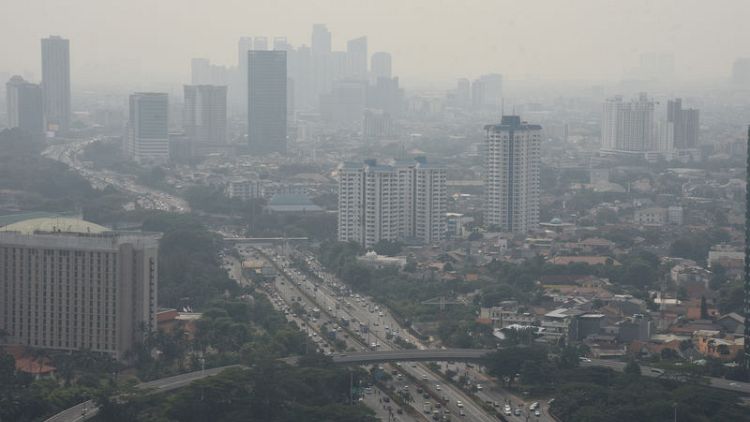 Indonesia's capital curbs private cars in bid to cut choking pollution