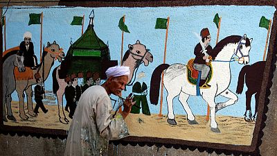 Egyptian artist paints murals on houses to celebrate haj Egyptian artist paints murals on houses to celebrate haj