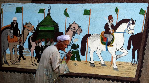 Egyptian artist paints murals on houses to celebrate haj Egyptian artist paints murals on houses to celebrate haj