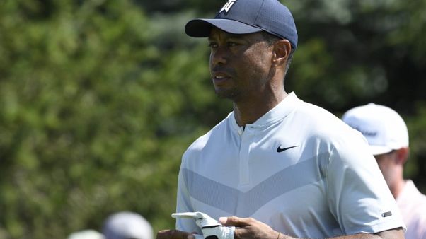 Woods withdraws from Northern Trust Open with stiff back Woods withdraws from Northern Trust Open with stiff back