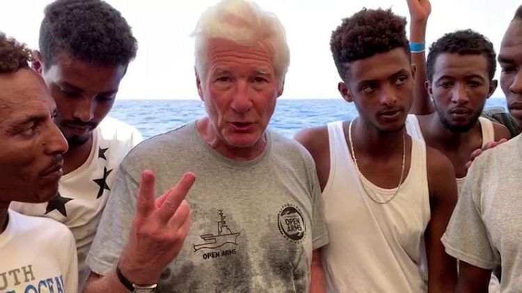 Hollywood star Gere visits stranded migrants on Open Arms ship