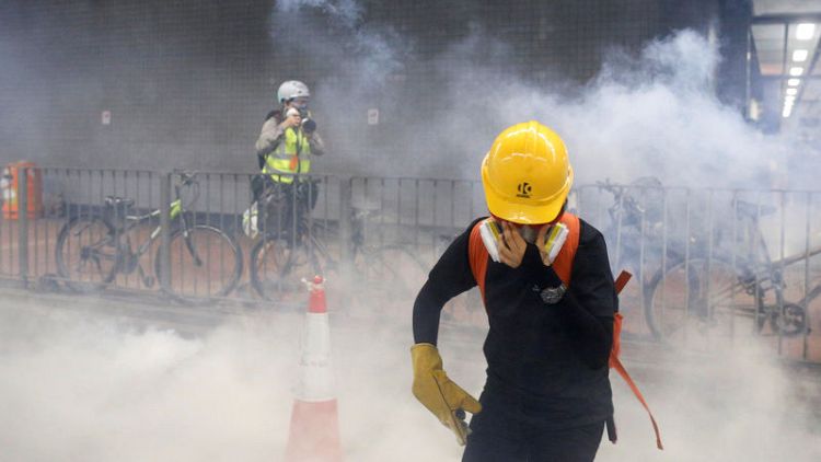 Hong Kong police fire tear gas during cat-and-mouse encounters