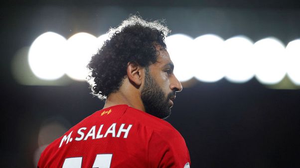 Salah comforts star-struck Liverpool fan who injured nose Salah comforts star-struck Liverpool fan who injured nose