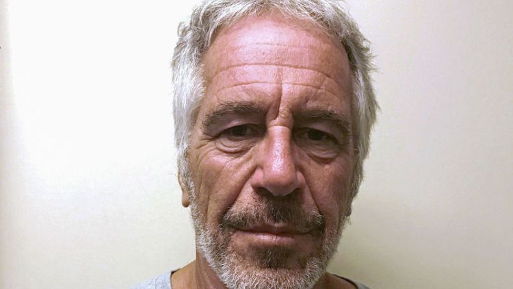 Warden at New York jail where financier Epstein died is removed