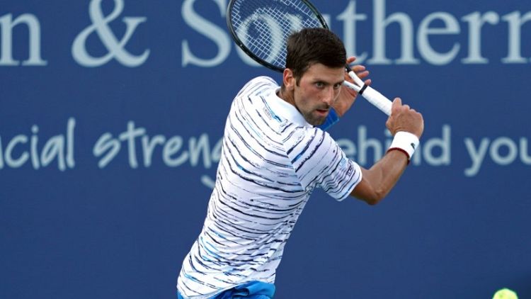 Djokovic shakes off rust, Federer rolls in Cincinnati