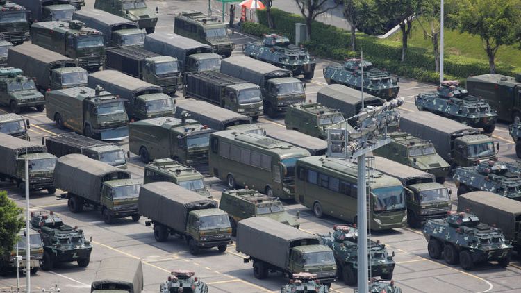 As Hong Kong braces for protests, Chinese paramilitary holds drills across border