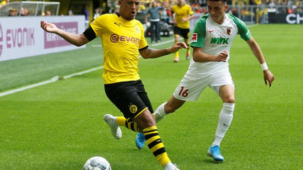 Dortmund crush Augsburg to set title marker in season opener Dortmund crush Augsburg to set title marker in season opener