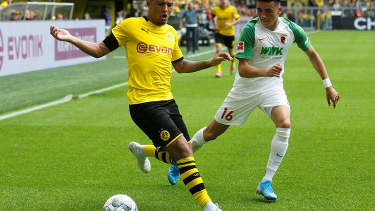 Dortmund crush Augsburg to set title marker in season opener