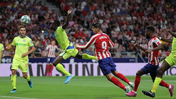Atletico off to winning start over Getafe as both sides see red Atletico off to winning start over Getafe as both sides see red