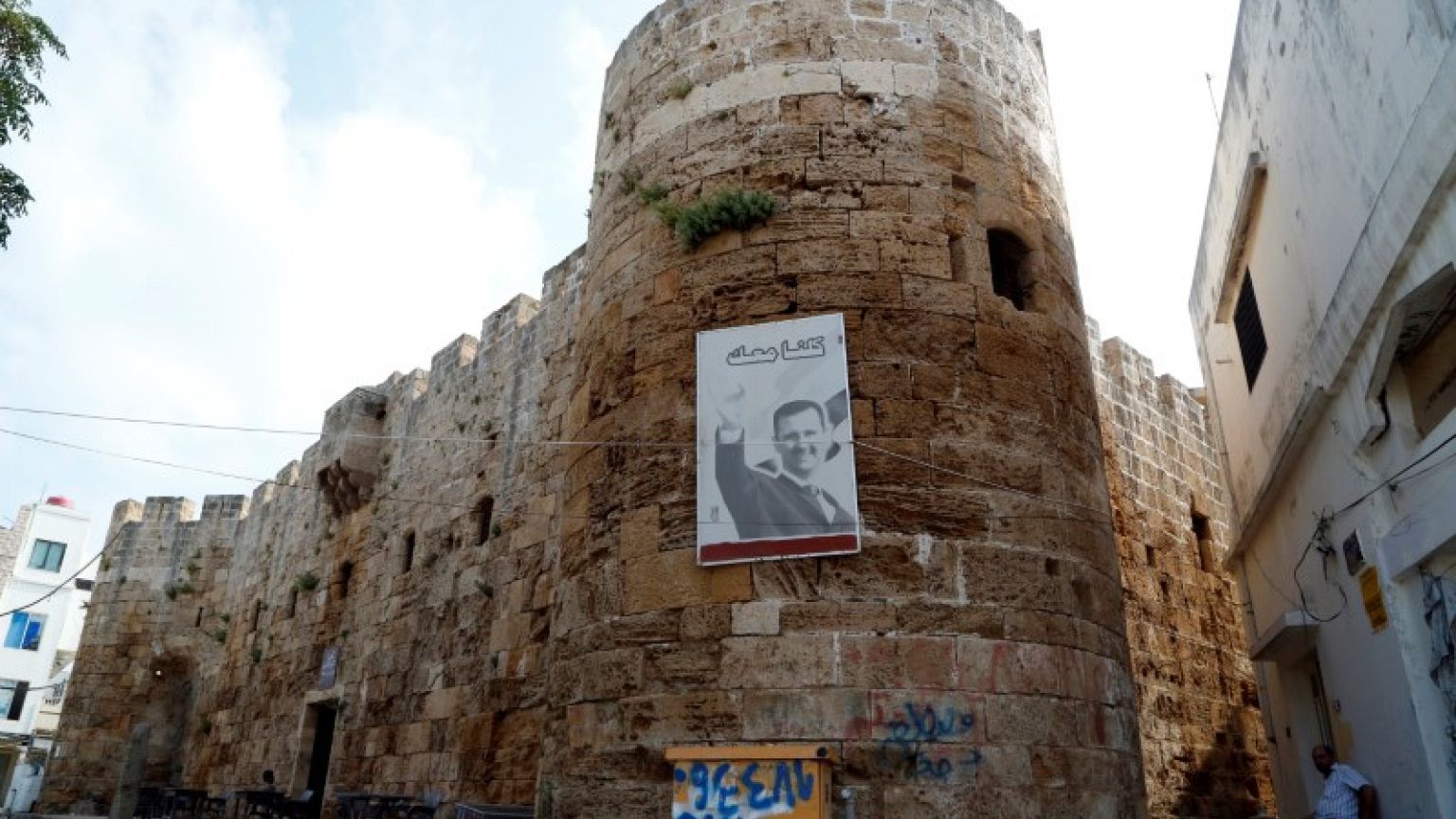 No shellfire or bullets, but war still intrudes on tiny Syrian island