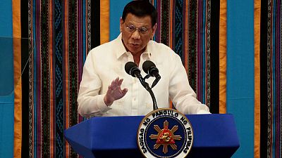 Philippines warns of 'unfriendly' greeting for uninvited warships Philippines warns of 'unfriendly' greeting for uninvited warships