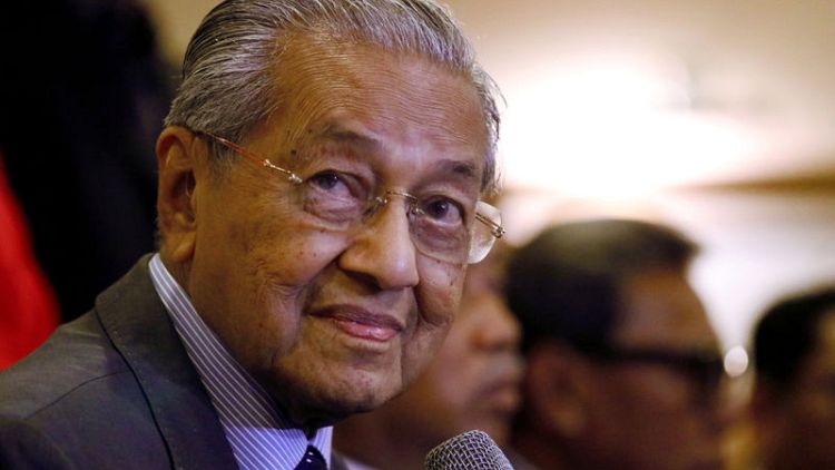 Malaysia's Mahathir says linking palm oil to deforestation 'baseless'