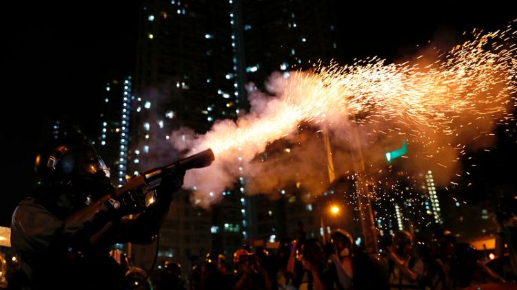 Hong Kong protests met with tear gas; China frees UK mission staffer