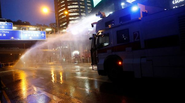 Hong Kong police turn water cannon on protesters, fire tear gas Hong Kong police turn water cannon on protesters, fire tear gas