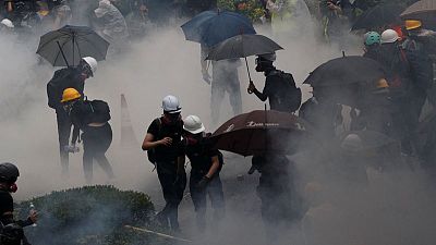 Hong Kong police arrest 36, youngest aged 12, after running battles with protesters Hong Kong police arrest 36, youngest aged 12, after running battles with protesters