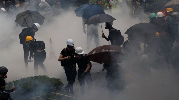 Hong Kong police arrest 36, youngest aged 12, after running battles with protesters