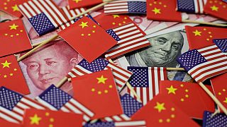 China's yuan slumps to 11-year low, stocks fall as U.S. trade war escalates