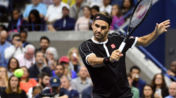 Federer overcomes Nagal scare to reach second round Federer overcomes Nagal scare to reach second round