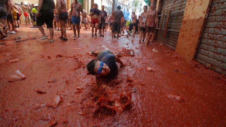 Playing ketchup in Spain - thousands wage the Tomatina fight