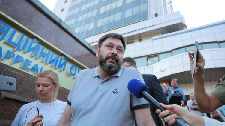 Ukraine frees jailed Russian journalist amid prisoner swap talks