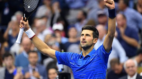 Djokovic overcomes shoulder woes to reach second round Djokovic overcomes shoulder woes to reach second round